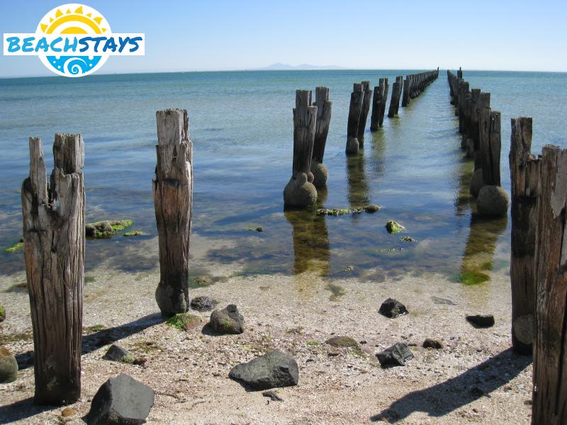 Dismantled pier on beach