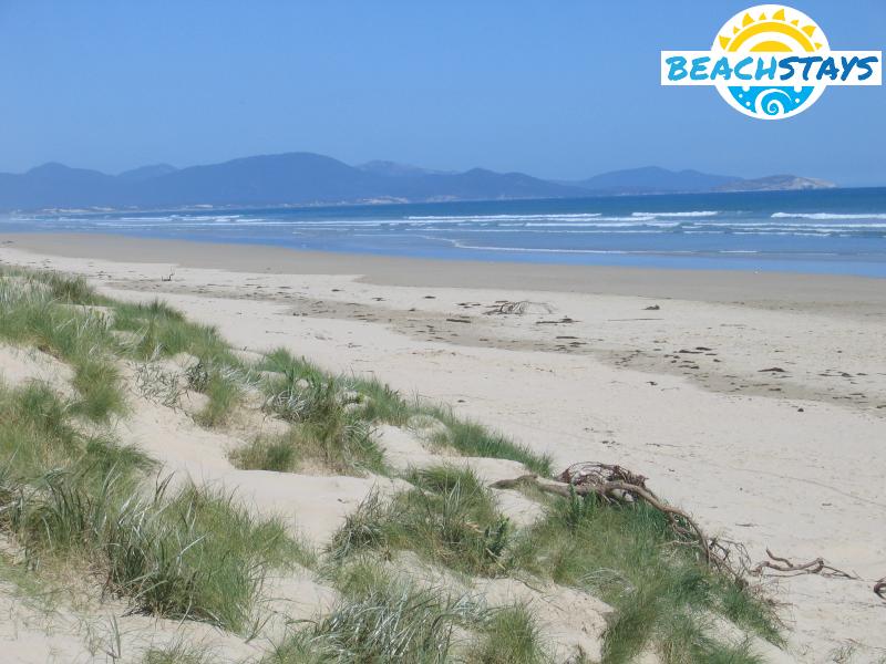 View along beach with Wilsons Promontory in the background
